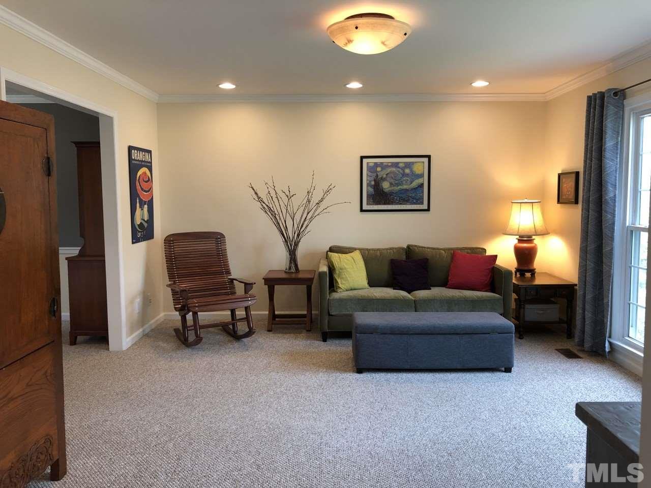 5412 Fairoaks Road Durham, NC 27712 - Photo 9 of 25 a living room with furniture and a lamp