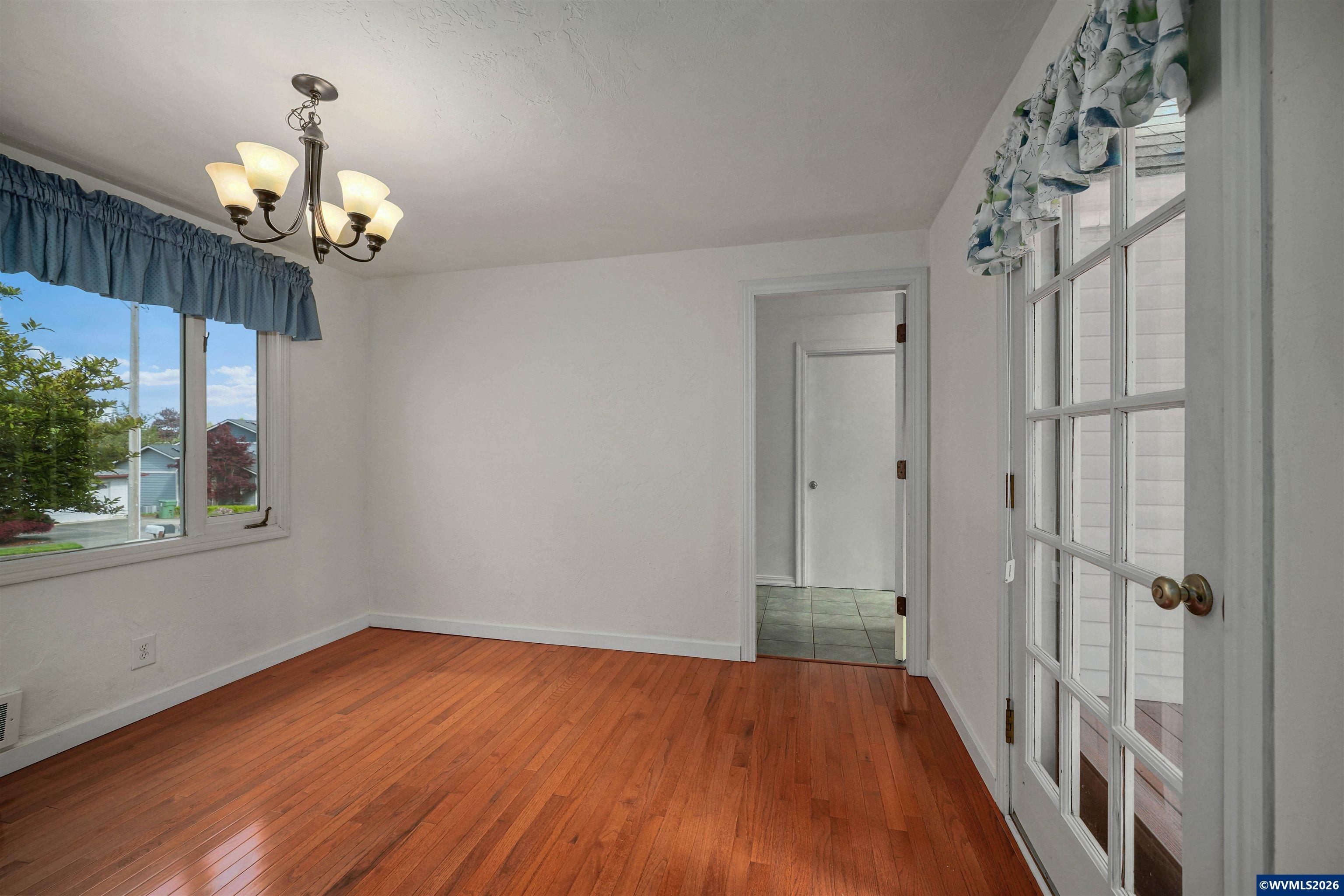 220 Northwest Downy Drive Sublimity, OR 97385 - Photo 16 of 47 wooden floor in an empty room with a window