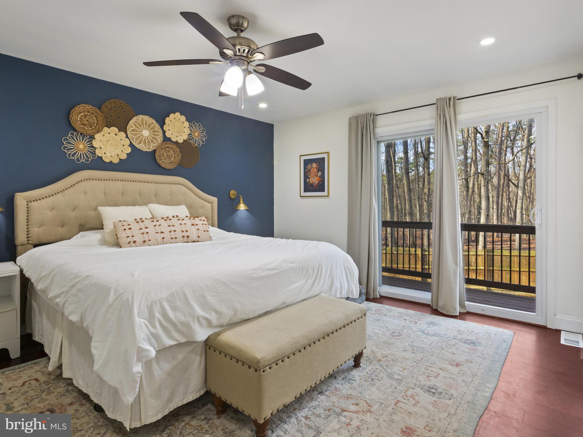 1371 Dicus Mill Road Severn, MD 21144 - Photo 12 of 35 a bedroom with a large bed and a chandelier