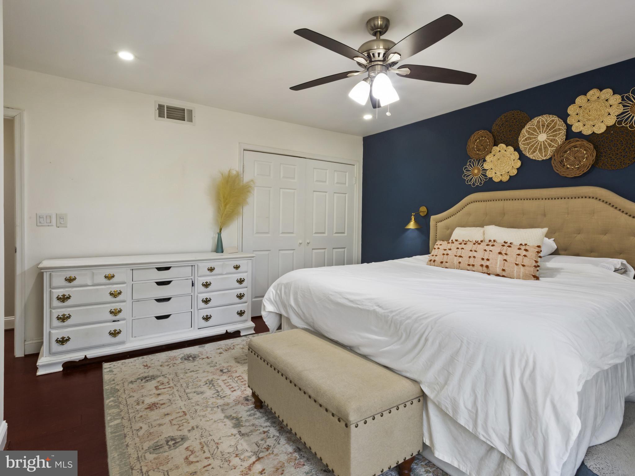 1371 Dicus Mill Road Severn, MD 21144 - Photo 14 of 35 a bedroom with a bed and a chandelier