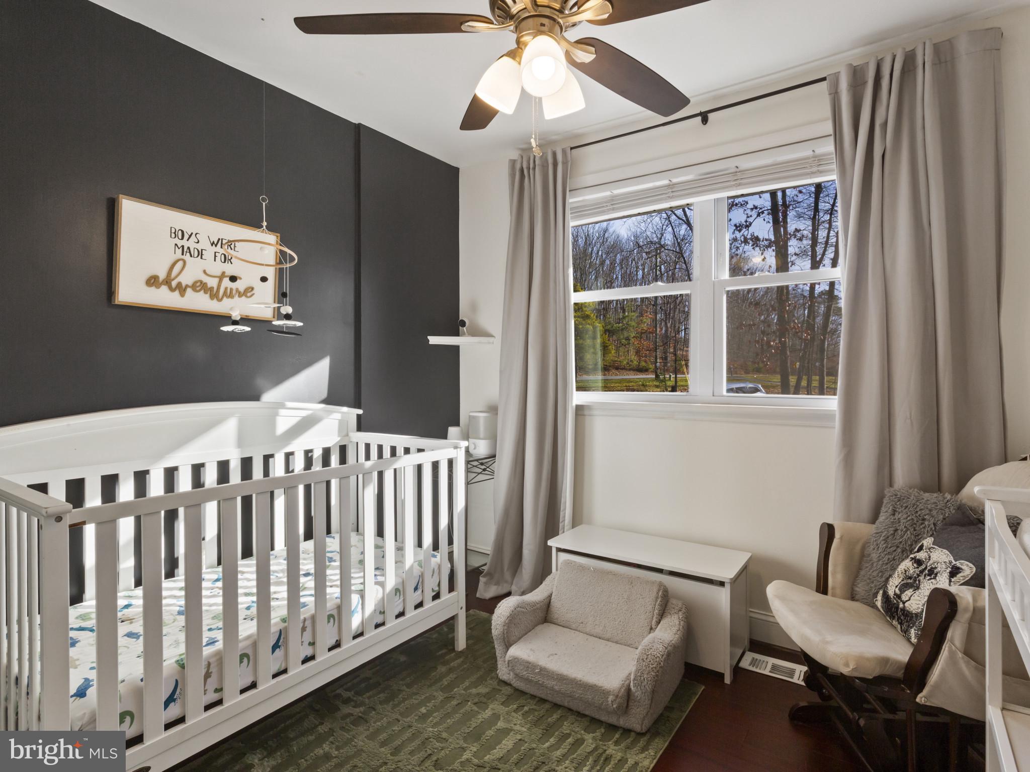 1371 Dicus Mill Road Severn, MD 21144 - Photo 18 of 35 a bedroom with furniture and a large window