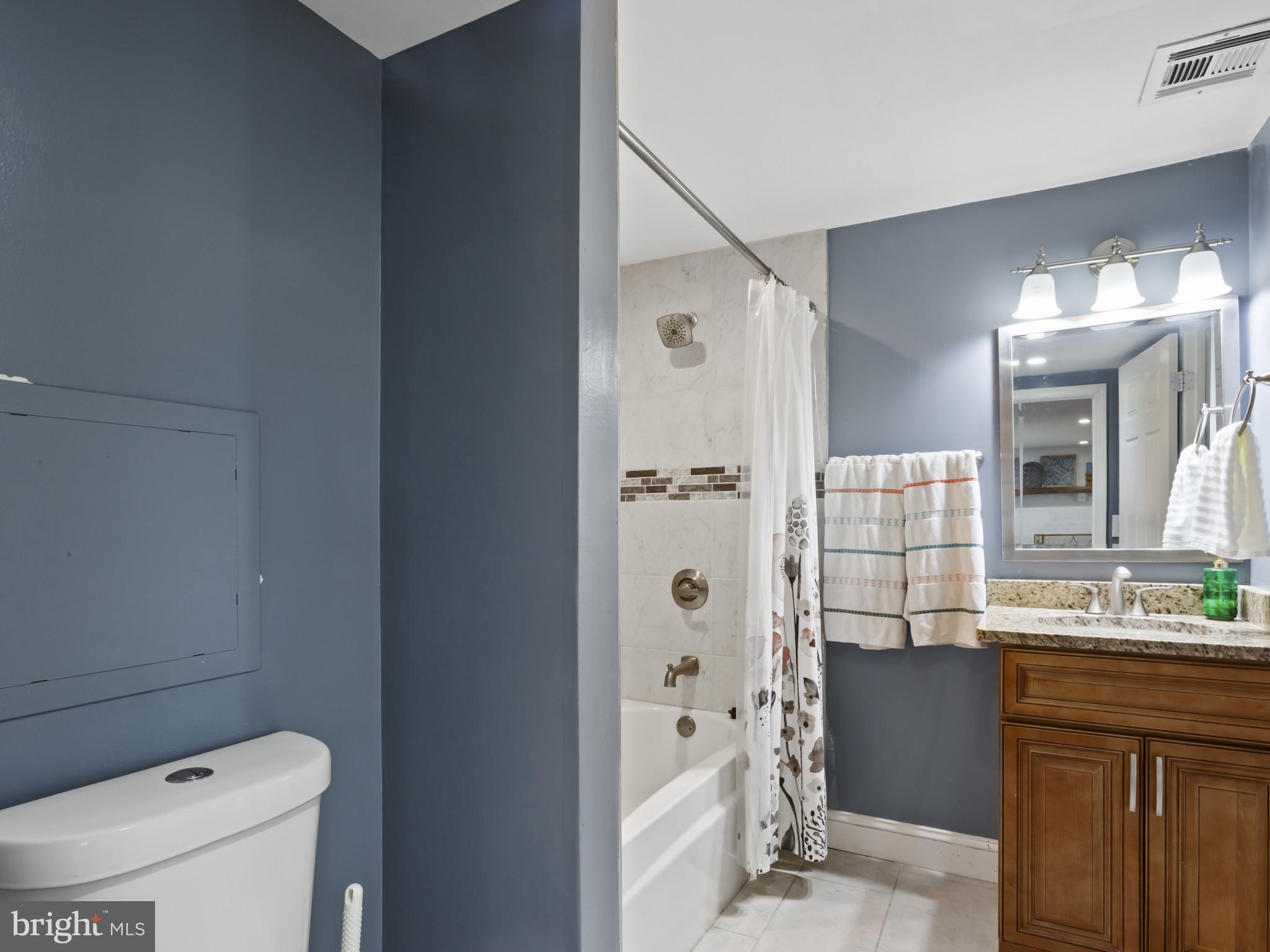 1371 Dicus Mill Road Severn, MD 21144 - Photo 20 of 35 a bathroom with a sink a toilet and shower