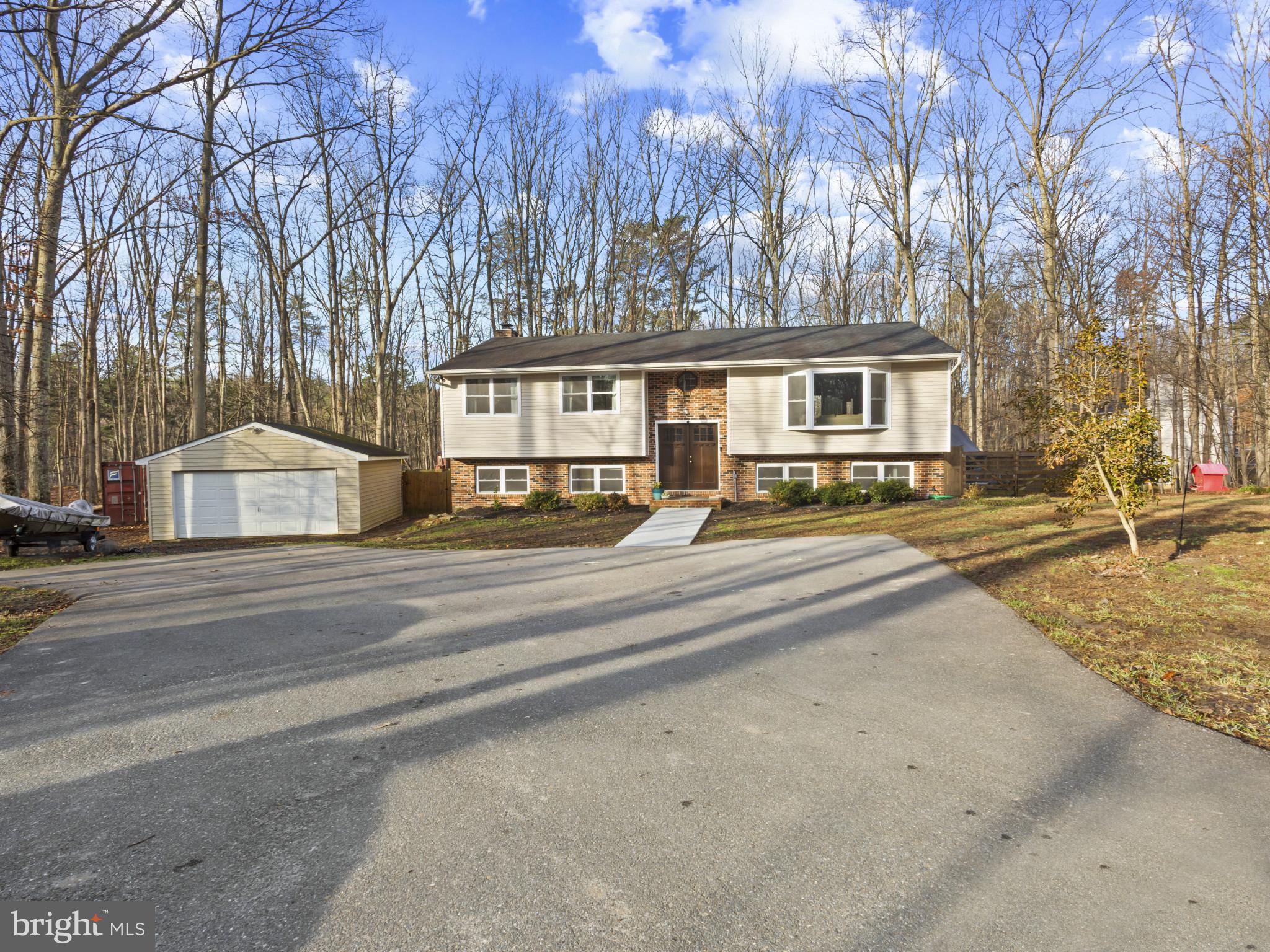 1371 Dicus Mill Road Severn, MD 21144 - Photo 2 of 35 a house with trees in front of it