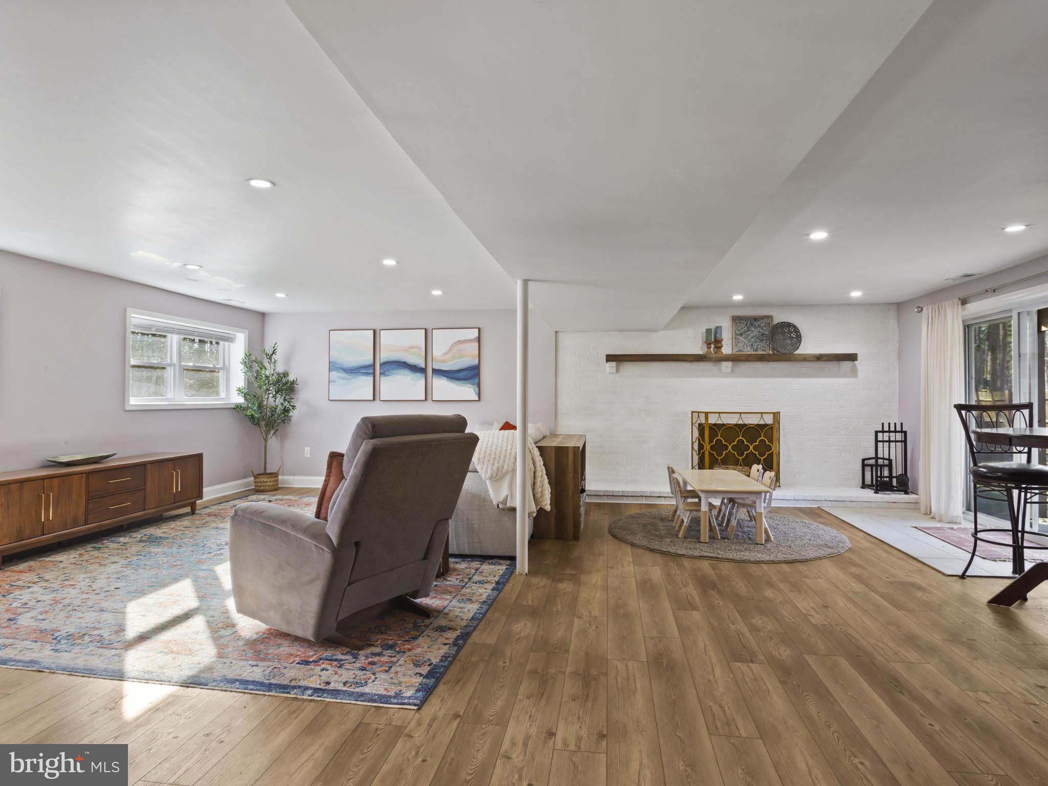 1371 Dicus Mill Road Severn, MD 21144 - Photo 23 of 35 a living room with furniture and a fireplace