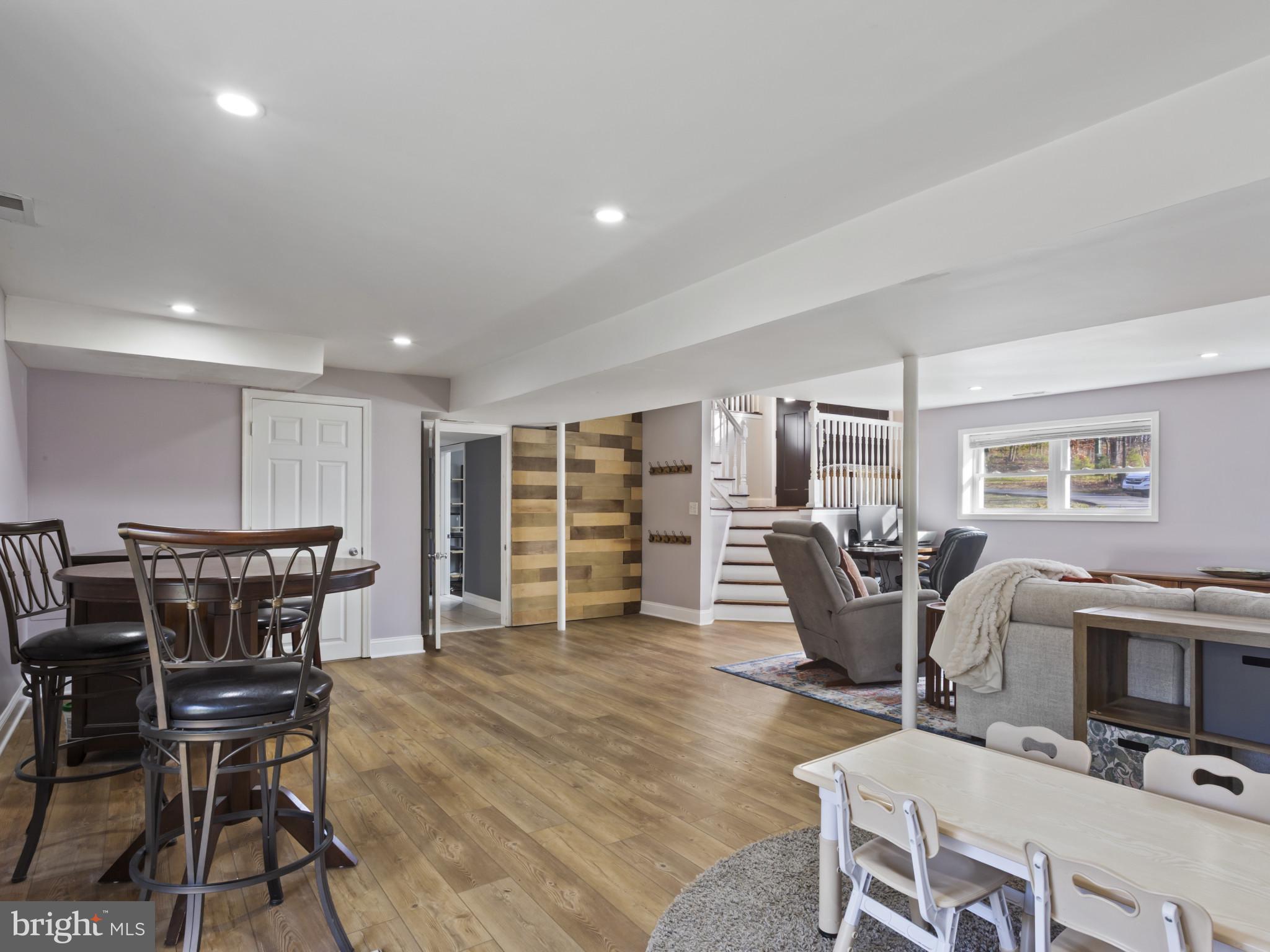 1371 Dicus Mill Road Severn, MD 21144 - Photo 24 of 35 a dining room with furniture and wooden floor