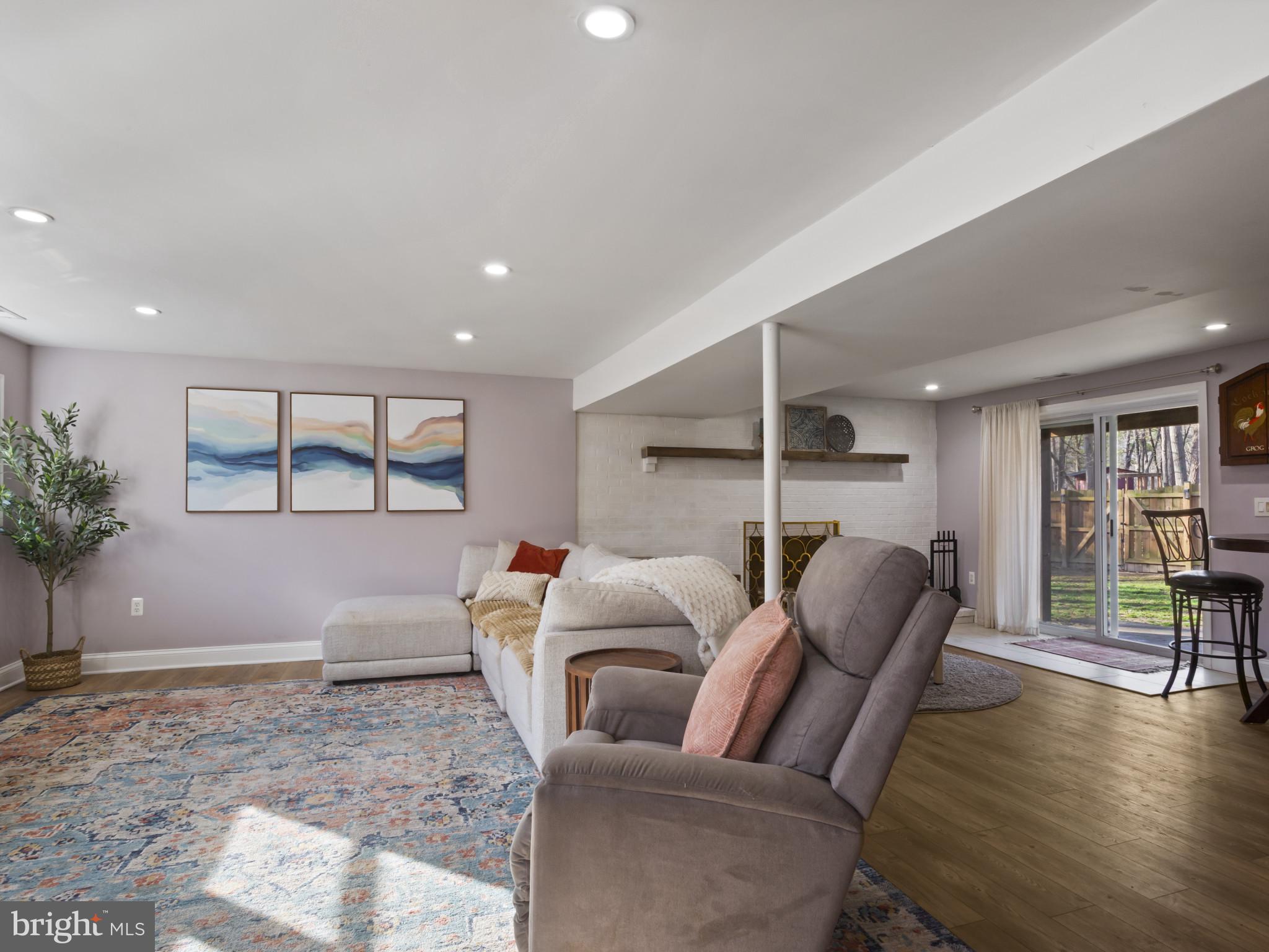 1371 Dicus Mill Road Severn, MD 21144 - Photo 25 of 35 a living room with furniture and a table