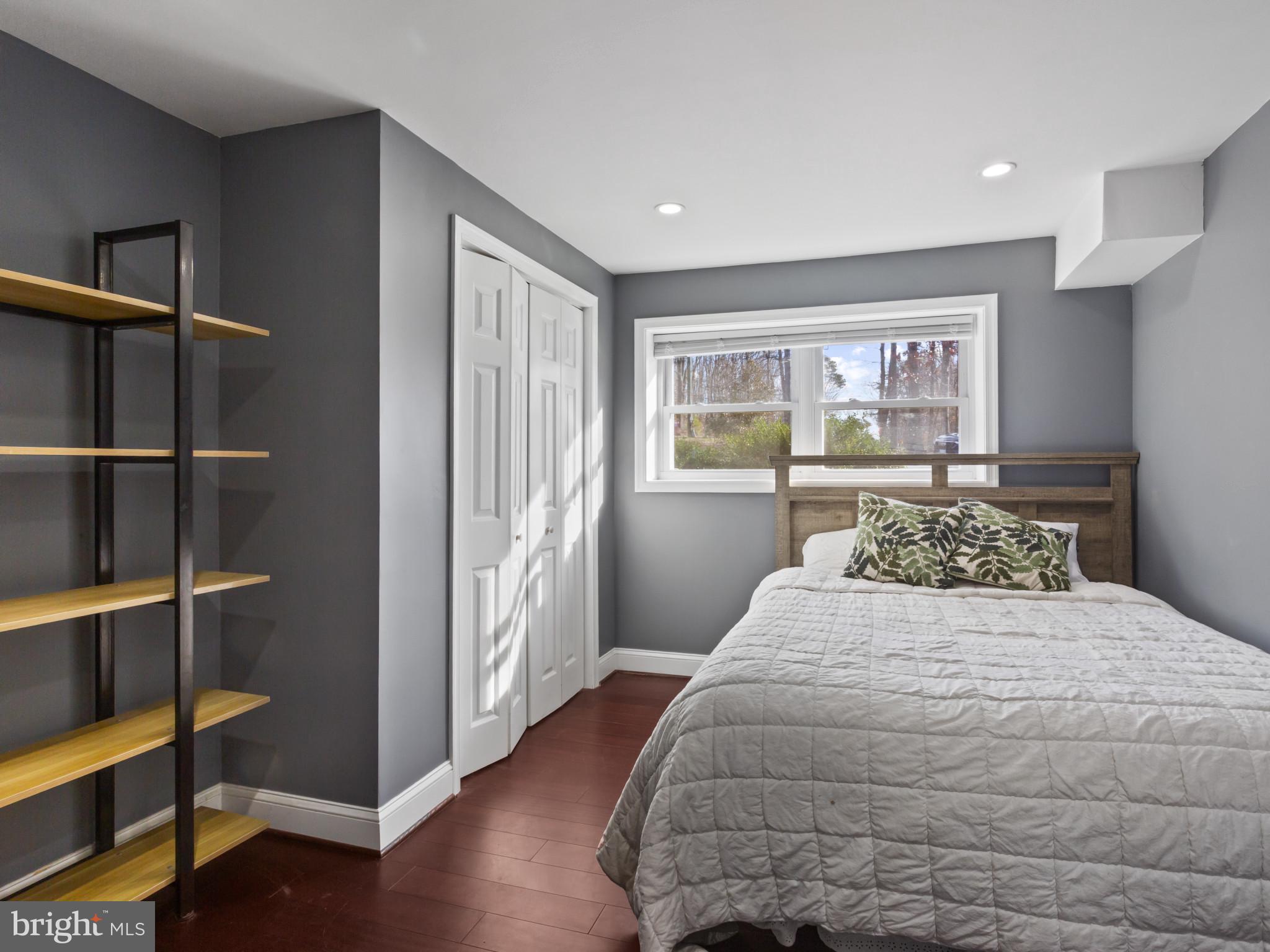 1371 Dicus Mill Road Severn, MD 21144 - Photo 26 of 35 a bedroom with a large bed and a window