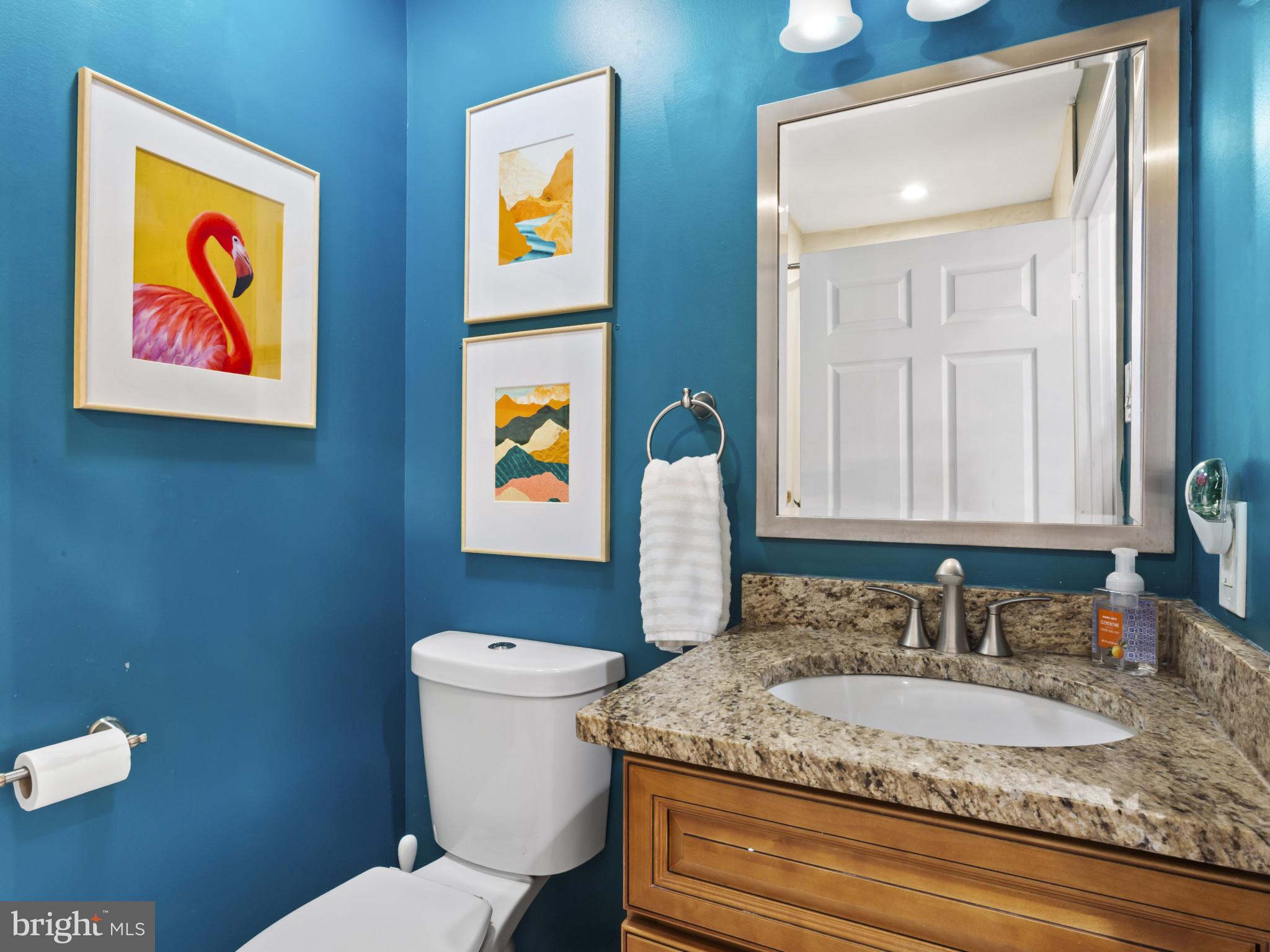 1371 Dicus Mill Road Severn, MD 21144 - Photo 28 of 35 a bathroom with a granite countertop sink and a mirror