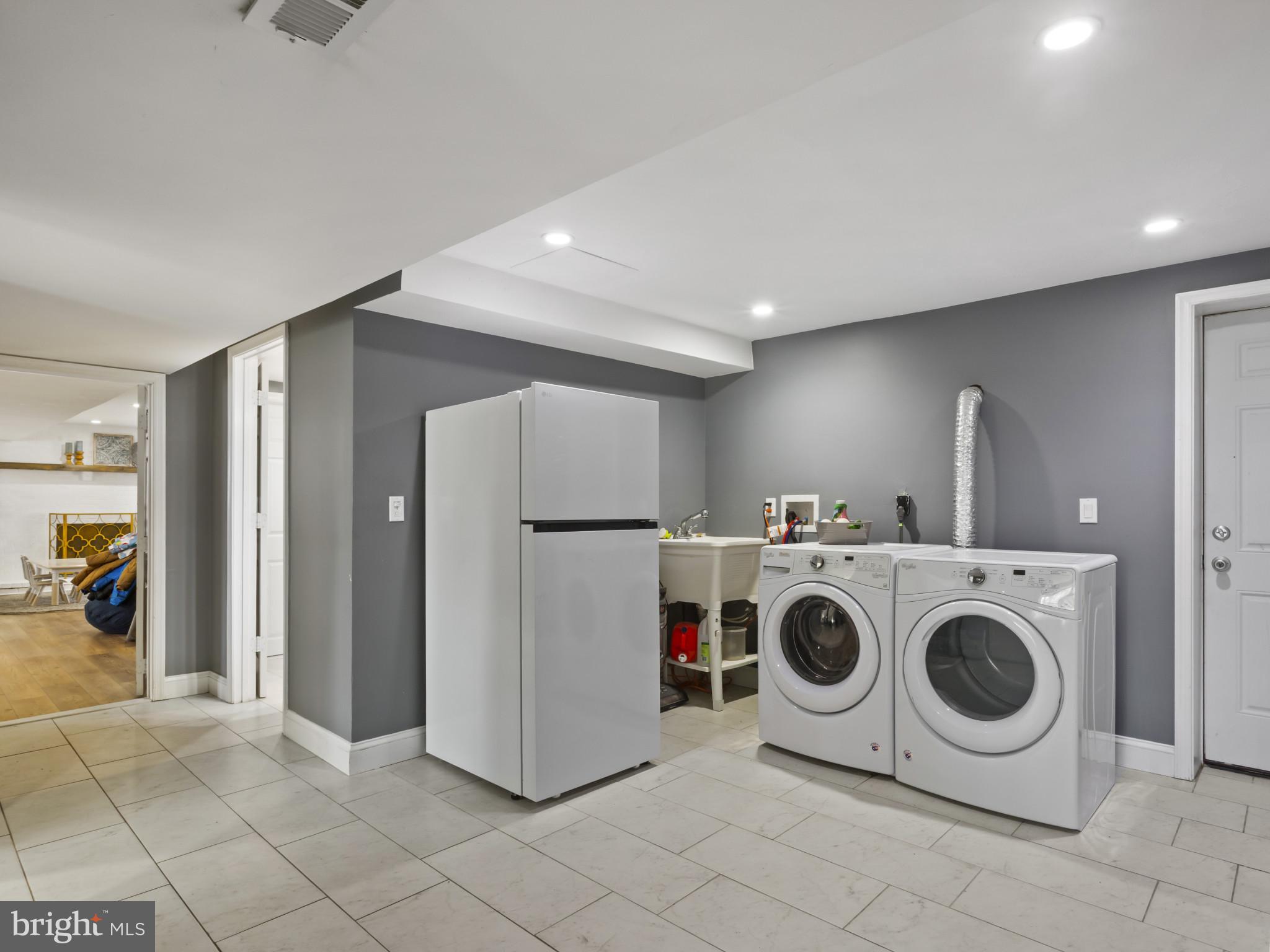 1371 Dicus Mill Road Severn, MD 21144 - Photo 30 of 35 a utility room with dryer and washer