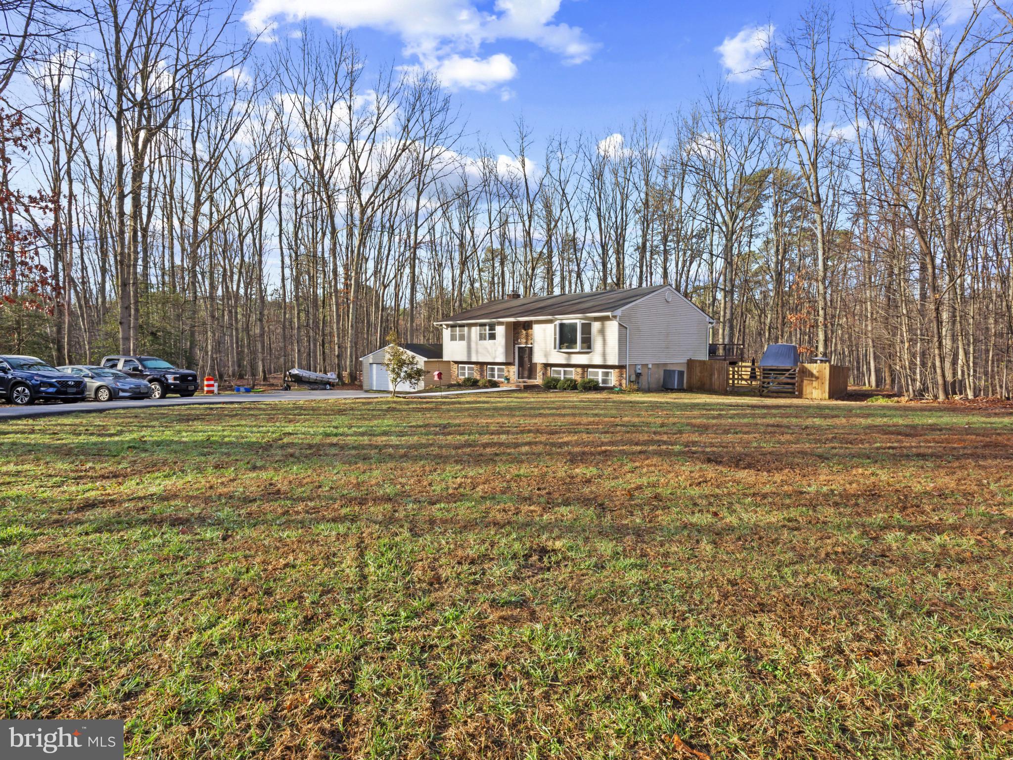 1371 Dicus Mill Road Severn, MD 21144 - Photo 3 of 35 a backyard of apartments with large trees