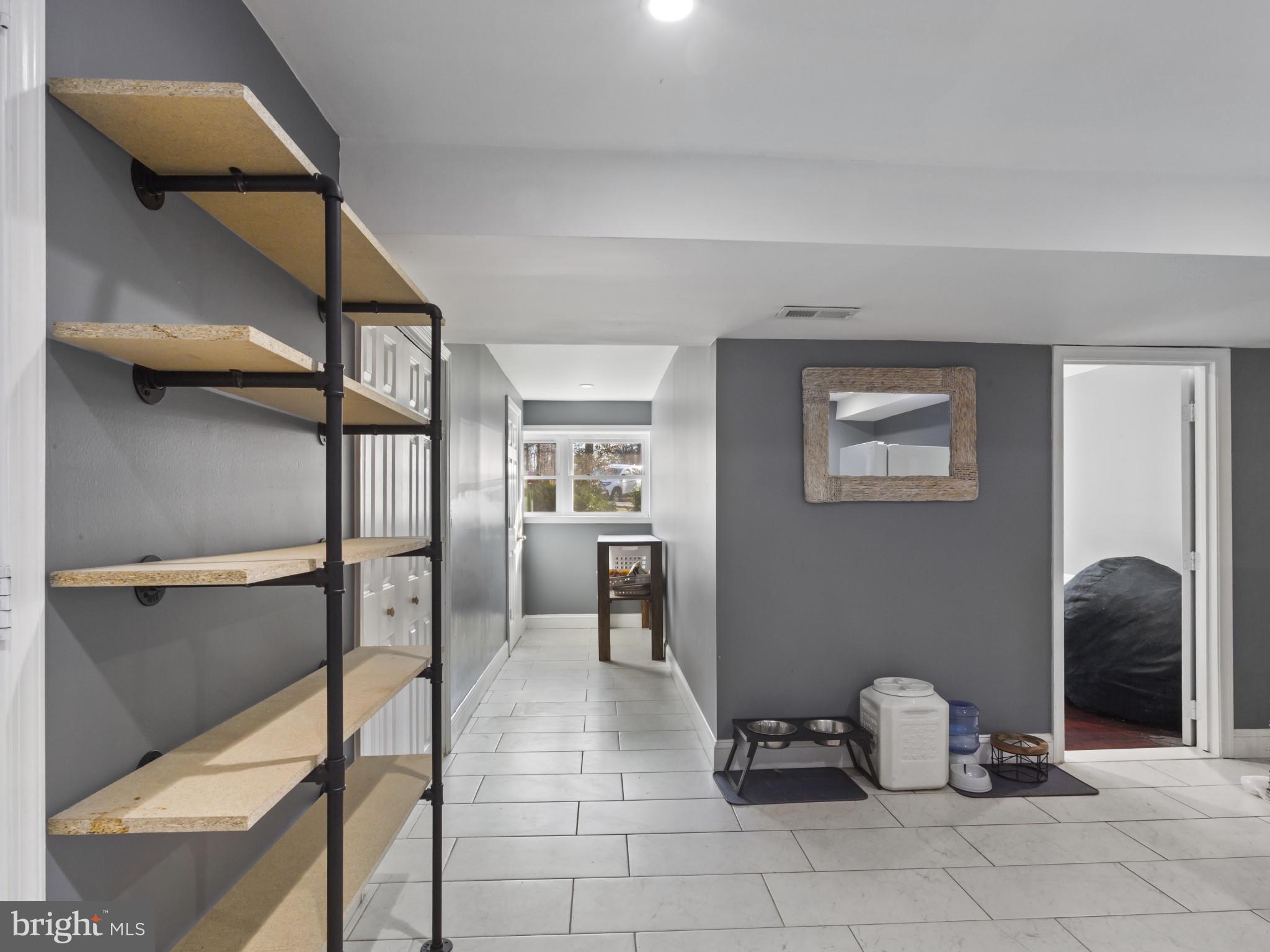 1371 Dicus Mill Road Severn, MD 21144 - Photo 31 of 35 a room with furniture and a window