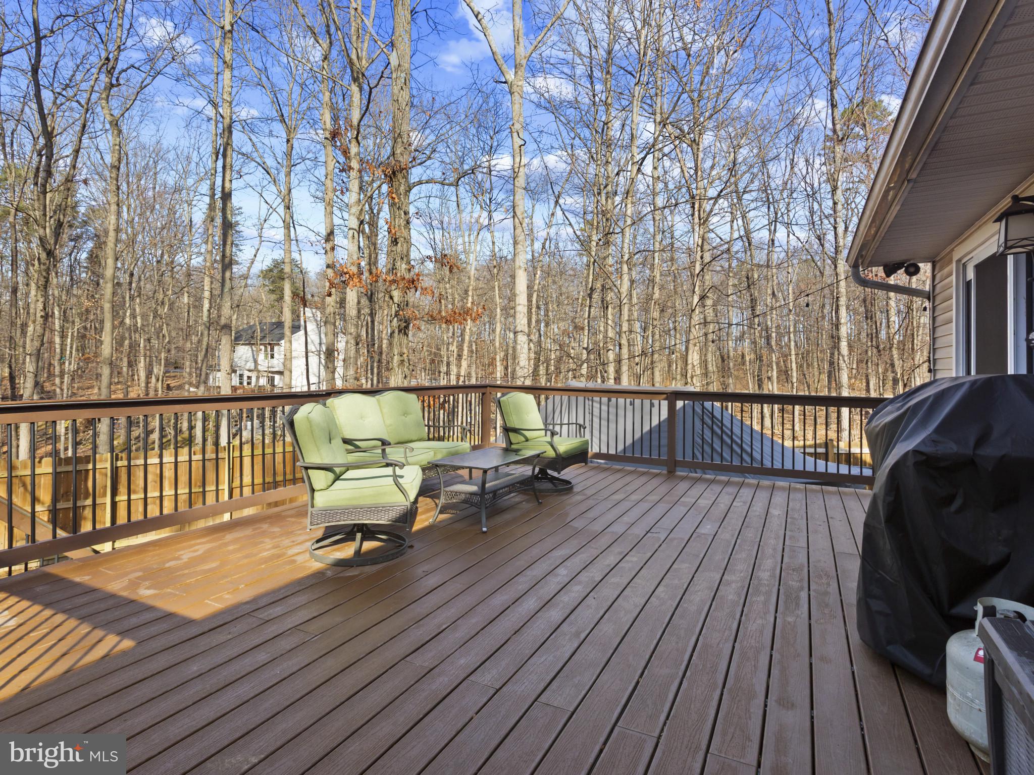 1371 Dicus Mill Road Severn, MD 21144 - Photo 33 of 35 a view of a roof deck with wooden floor and fence