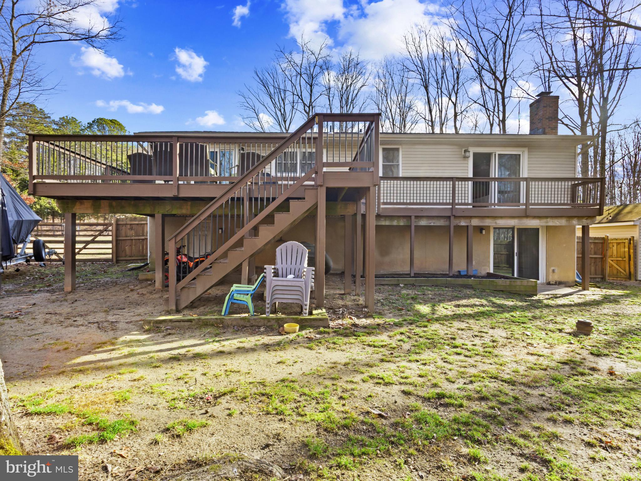 1371 Dicus Mill Road Severn, MD 21144 - Photo 34 of 35 a view of a house with large windows and a small yard