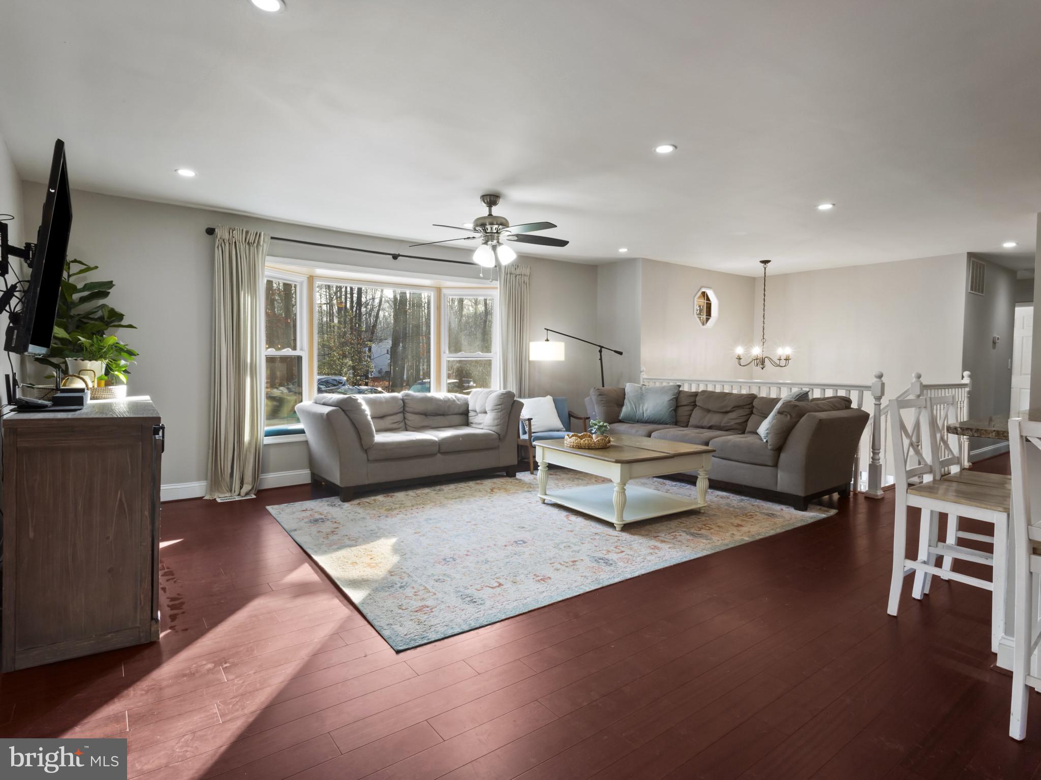 1371 Dicus Mill Road Severn, MD 21144 - Photo 6 of 35 a living room with furniture and a chandelier