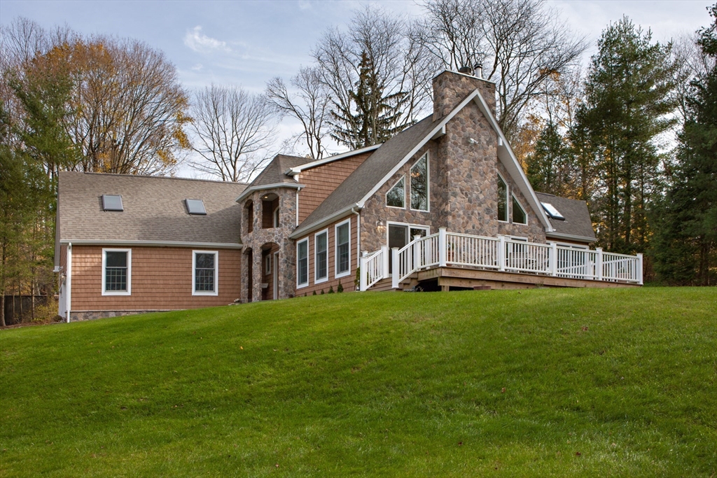 Lot 1 Marcy Road Otis, MA 01253 - Photo 2 of 15 a view of a house with a big yard and large trees