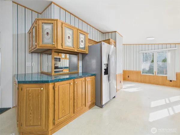 a view of a refrigerator in kitchen