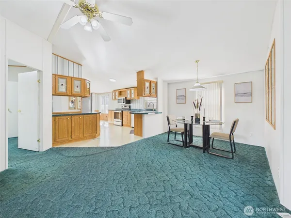 a view of a kitchen and dining room