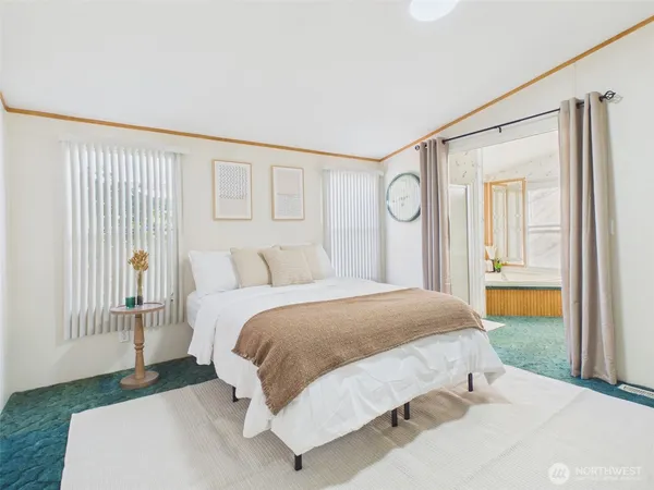 a bedroom with a bed and a cabinets