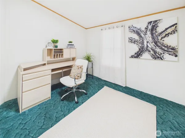 a living room with furniture and a rug