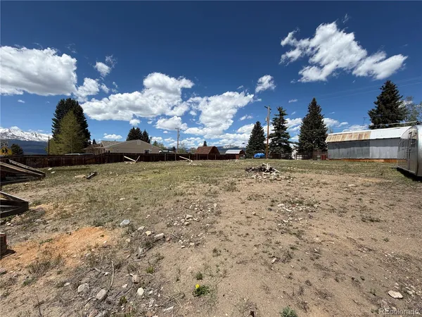 a view of a backyard of the house