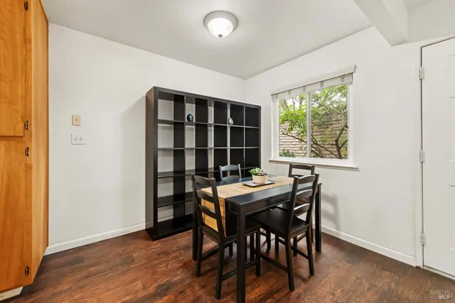 a view of a dining room with furniture and window