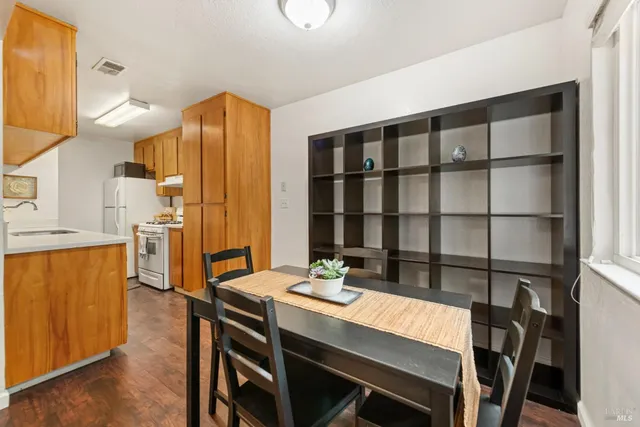 a dining room with a table and chairs