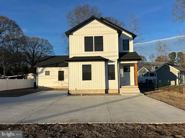 a front view of a house with yard
