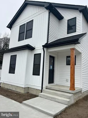 a front view of a house with garage