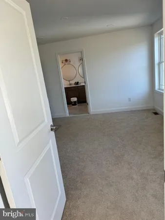a view of livingroom and hardwood floor