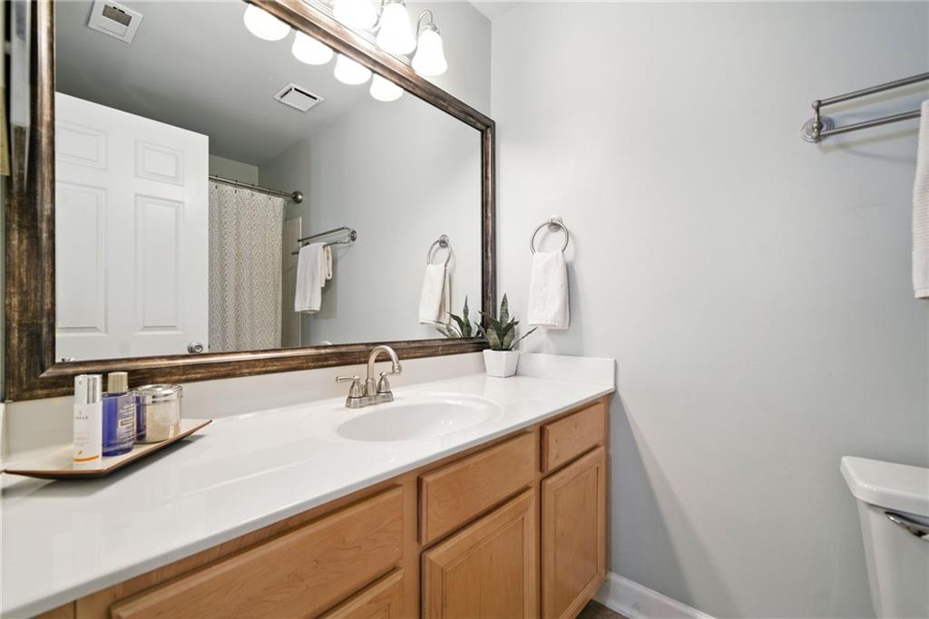 44 Mt Vernon Circle Sandy Springs, GA 30338 - Photo 15 of 27 a bathroom with a sink and a mirror