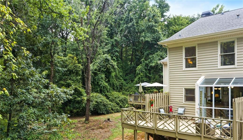 44 Mt Vernon Circle Sandy Springs, GA 30338 - Photo 21 of 27 a front view of a house with a garden