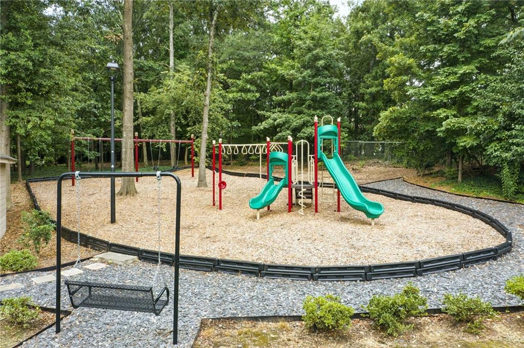 44 Mt Vernon Circle Sandy Springs, GA 30338 - Photo 26 of 27 a view of a park with swings