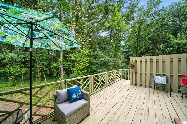 a view of a wooden deck with furniture