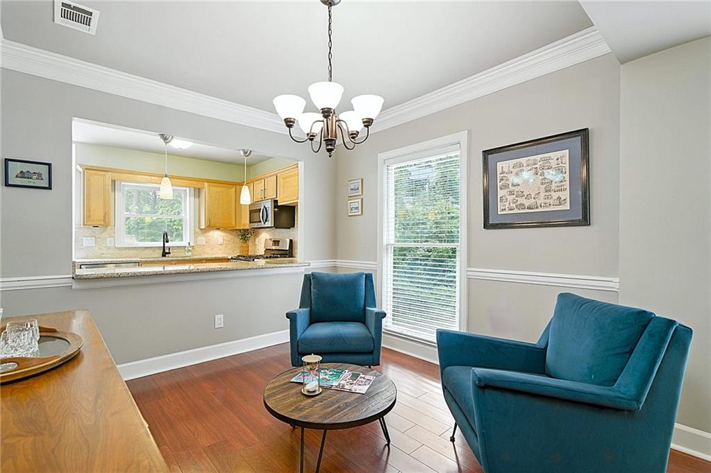 44 Mt Vernon Circle Sandy Springs, GA 30338 - Photo 7 of 27 a view of a dining room with furniture window and wooden floor