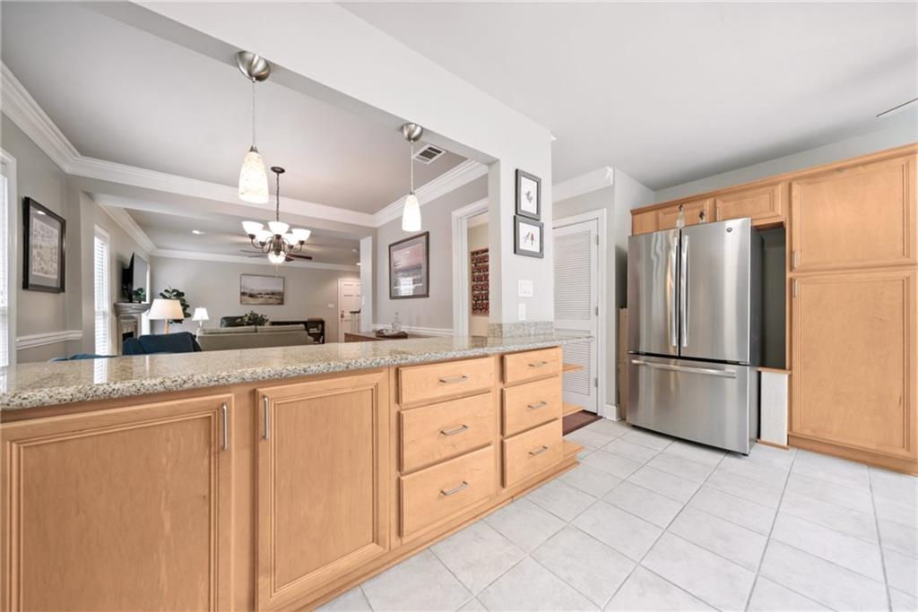 44 Mt Vernon Circle Sandy Springs, GA 30338 - Photo 8 of 27 a kitchen with granite countertop a refrigerator and a sink