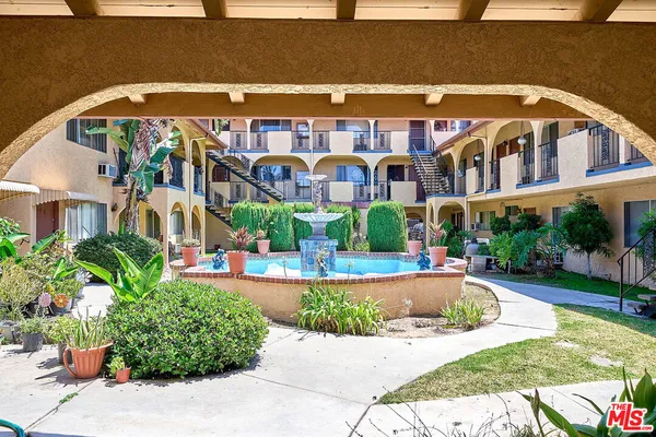 a front view of a building with garden