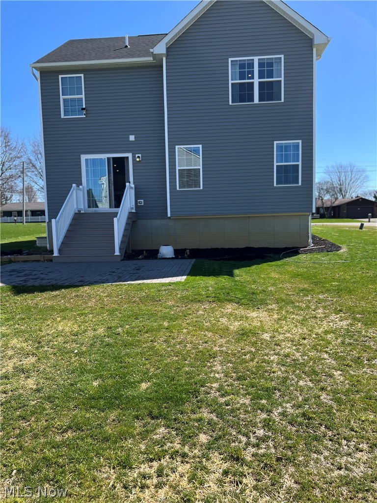15012 Decourcey Rittman, OH 44270 - Photo 2 of 26 Back of house with a yard