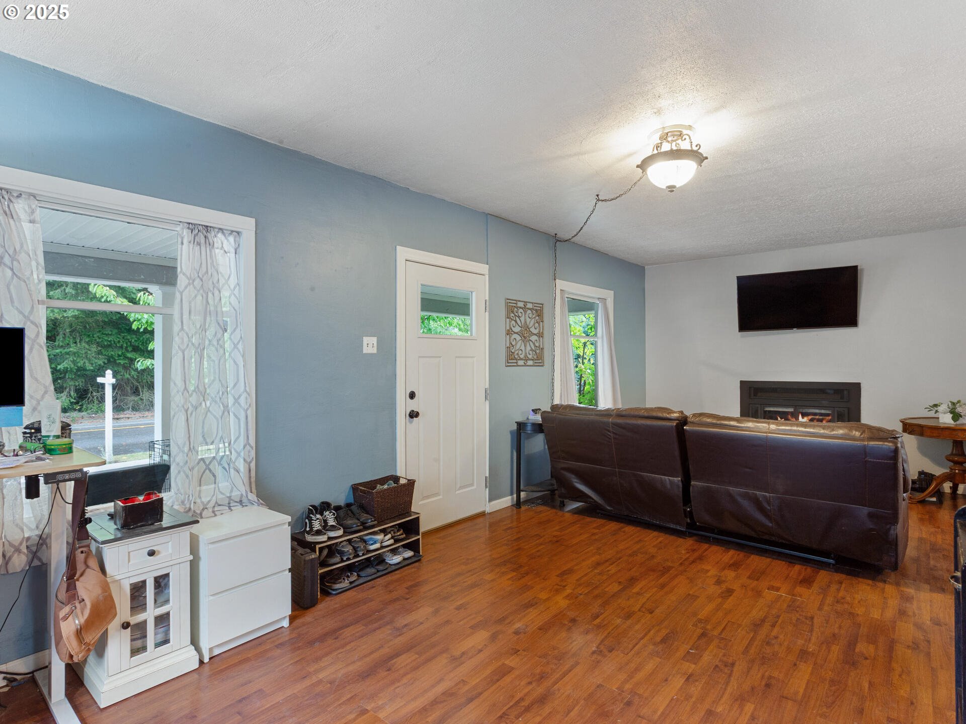 933 North Main Avenue Ridgefield, WA 98642 - Photo 14 of 42 a living room with furniture and a flat screen tv