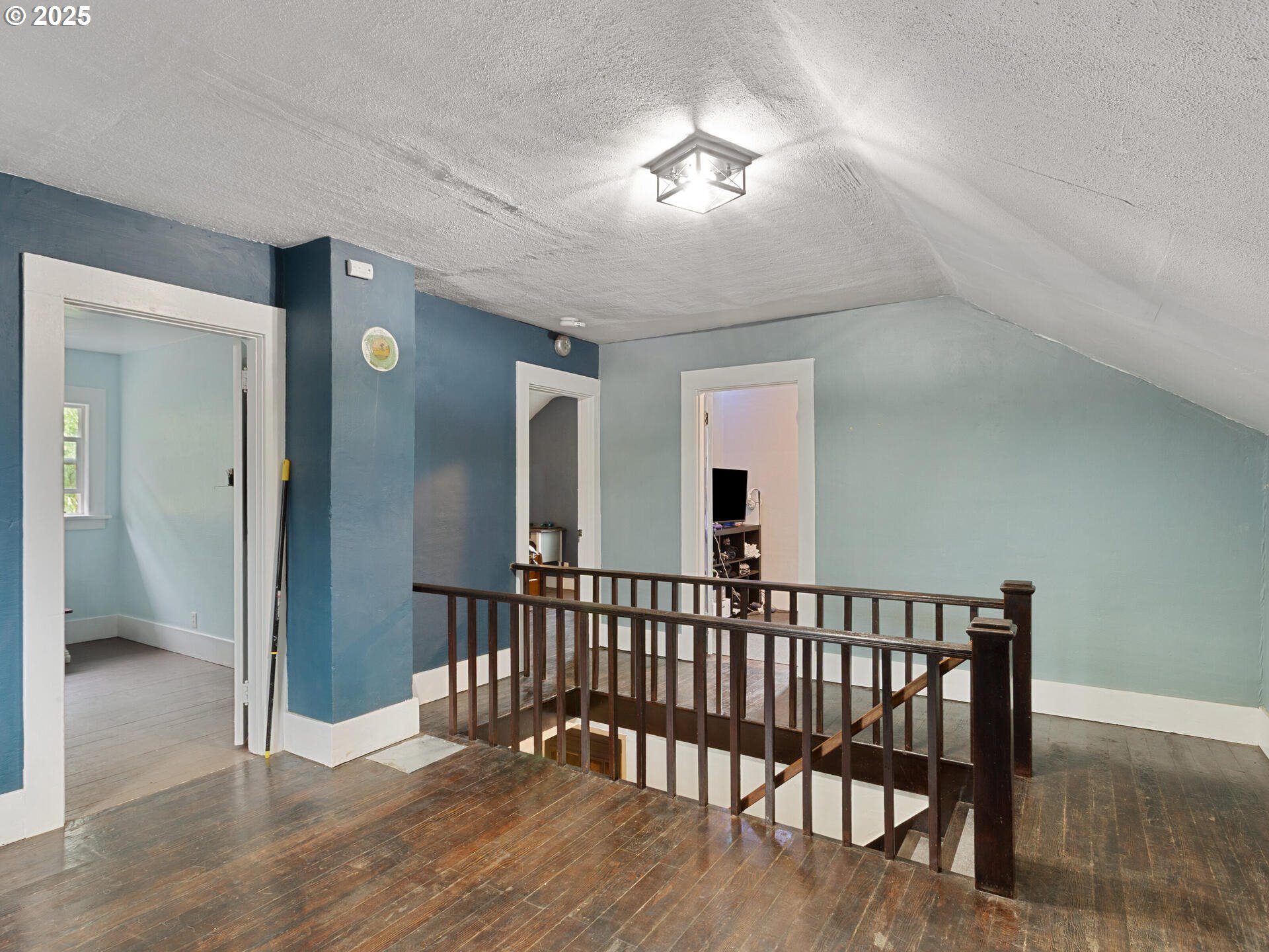 933 North Main Avenue Ridgefield, WA 98642 - Photo 23 of 42 a view of a hallway with bedroom and wooden floor