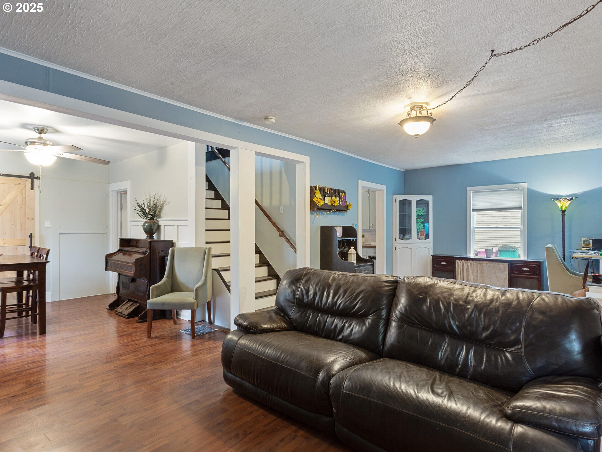 933 North Main Avenue Ridgefield, WA 98642 - Photo 9 of 42 a living room with furniture and a wooden floor