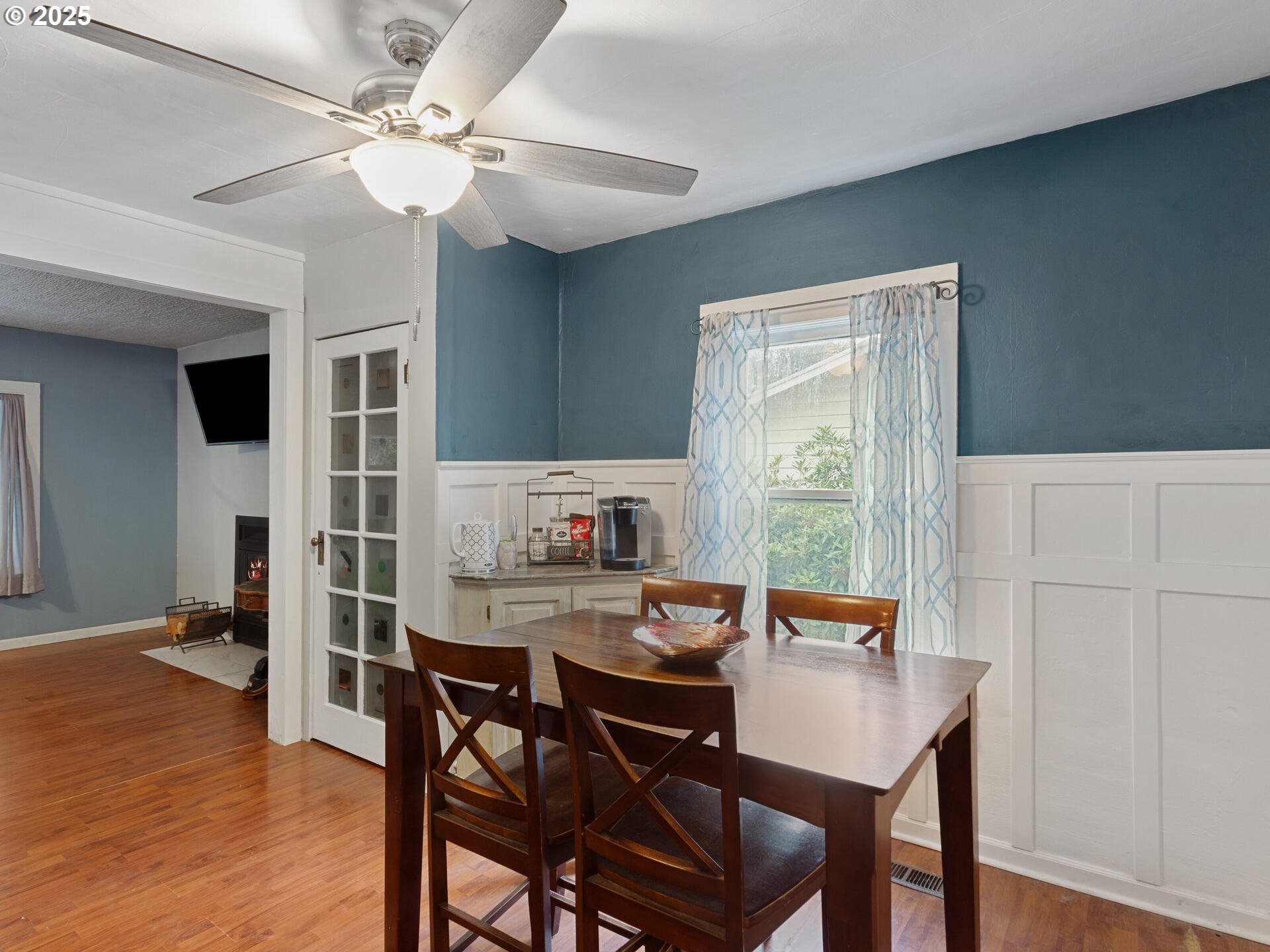 933 North Main Avenue Ridgefield, WA 98642 - Photo 10 of 42 a view of a dining room with furniture window and wooden floor