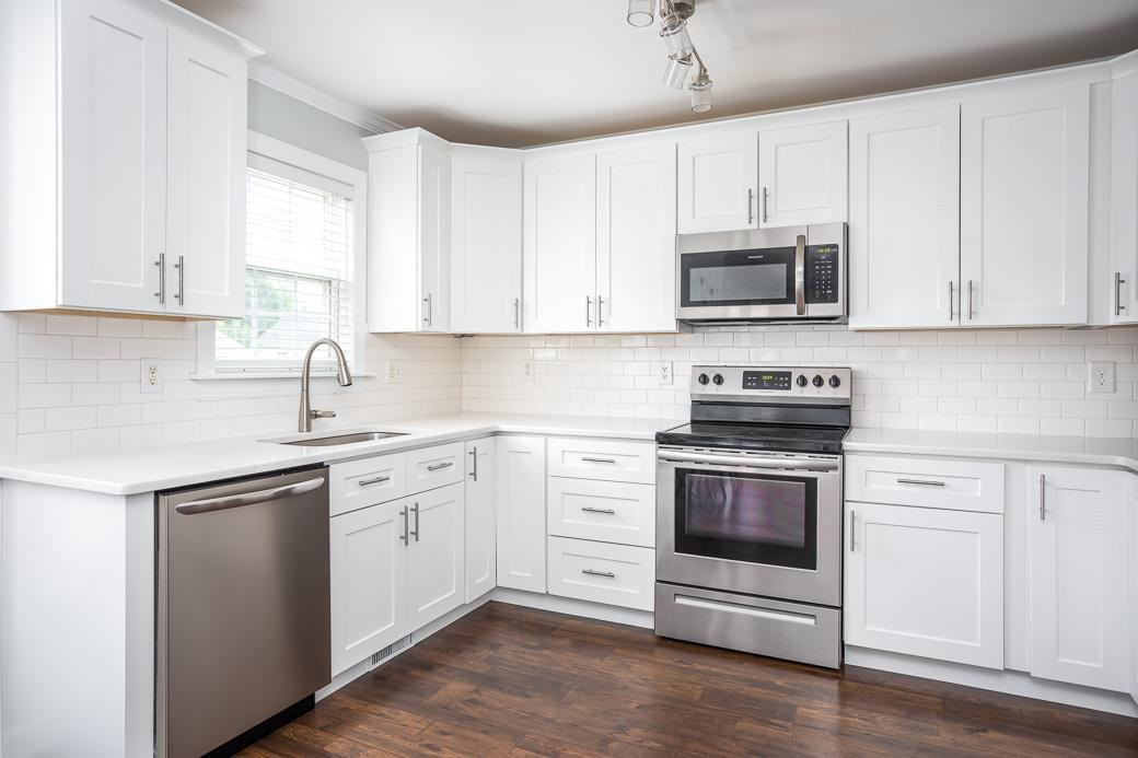 8908 Castleton Lane Raleigh, NC 27615 - Photo 11 of 28 Updated in 2019, enjoy new cabinets, countertops, flooring, and SS appliances Kitchen
