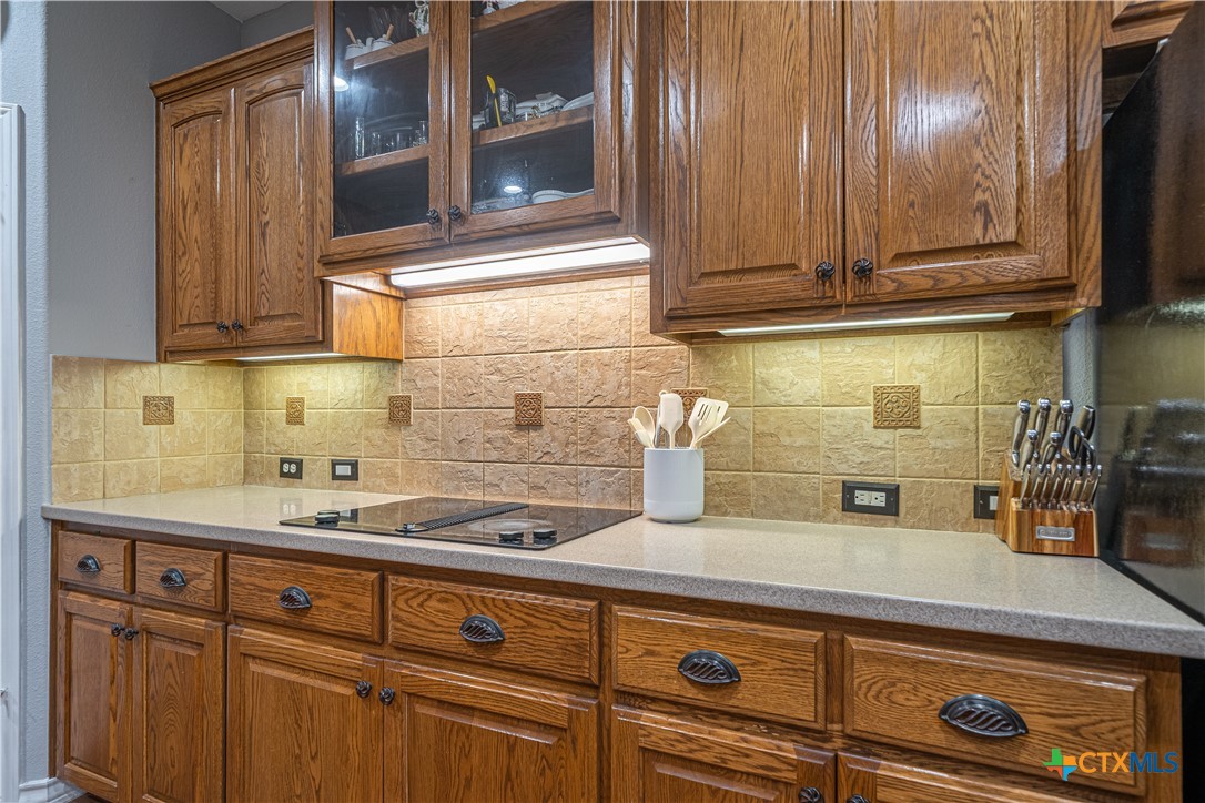 519 Long Meadow Spring Branch, TX 78070 - Photo 12 of 33 a kitchen with granite countertop cabinets and white appliances