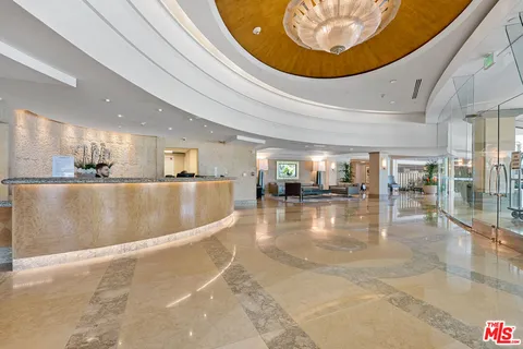 a view of a hallway with seating area