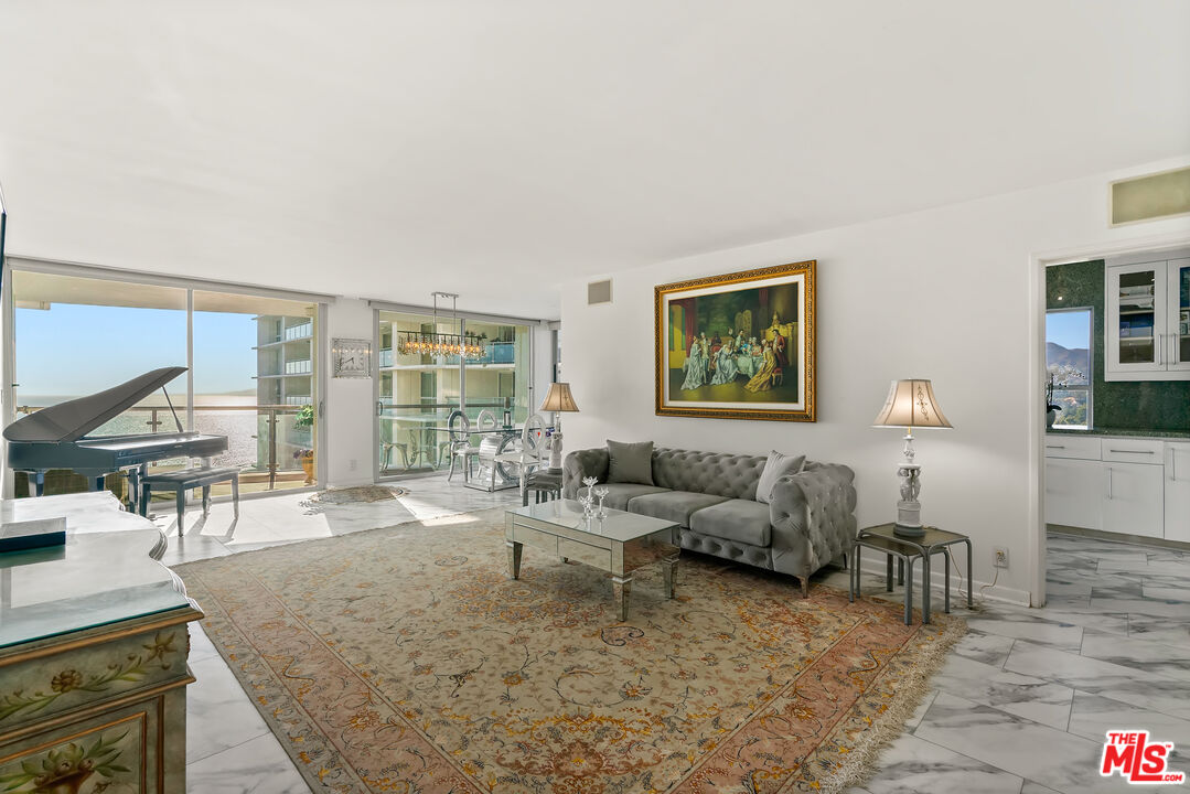 201 Ocean Avenue, Unit 1204B Santa Monica, CA 90402 - Photo 2 of 26 a living room with furniture and a large window
