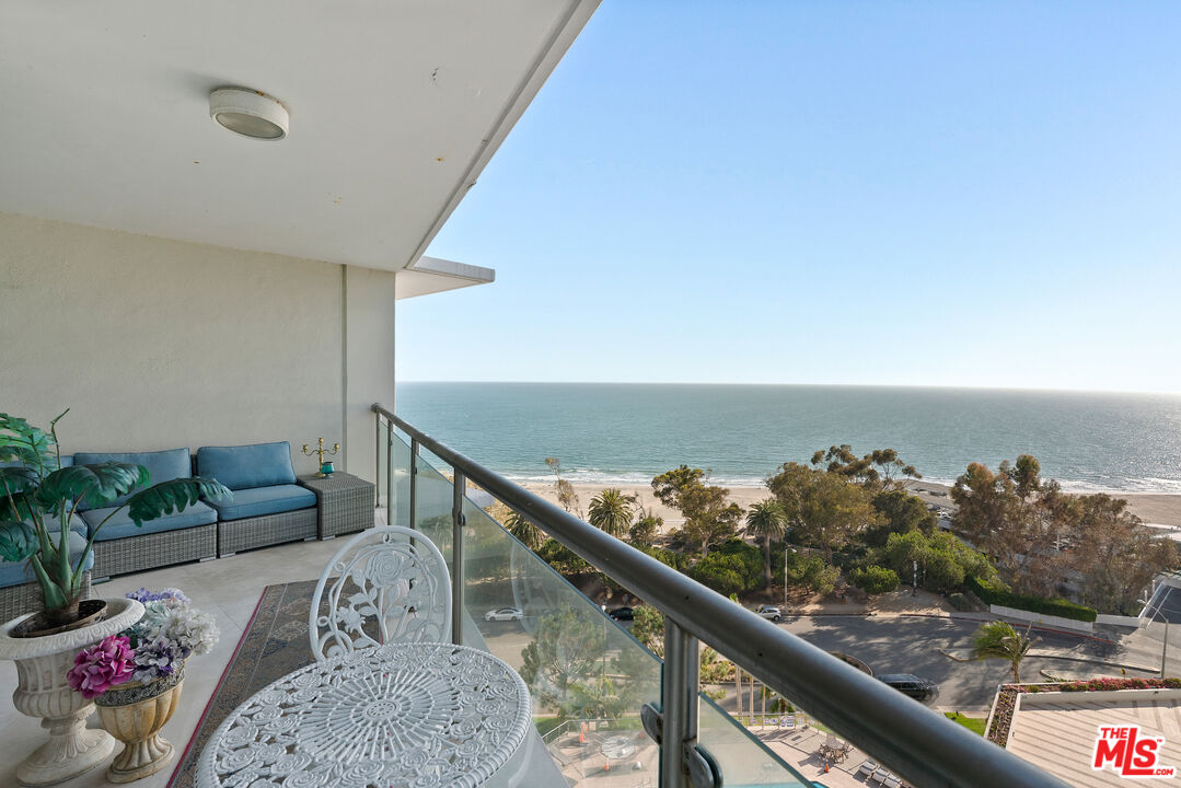 201 Ocean Avenue, Unit 1204B Santa Monica, CA 90402 - Photo 5 of 26 a living room with furniture and flowers