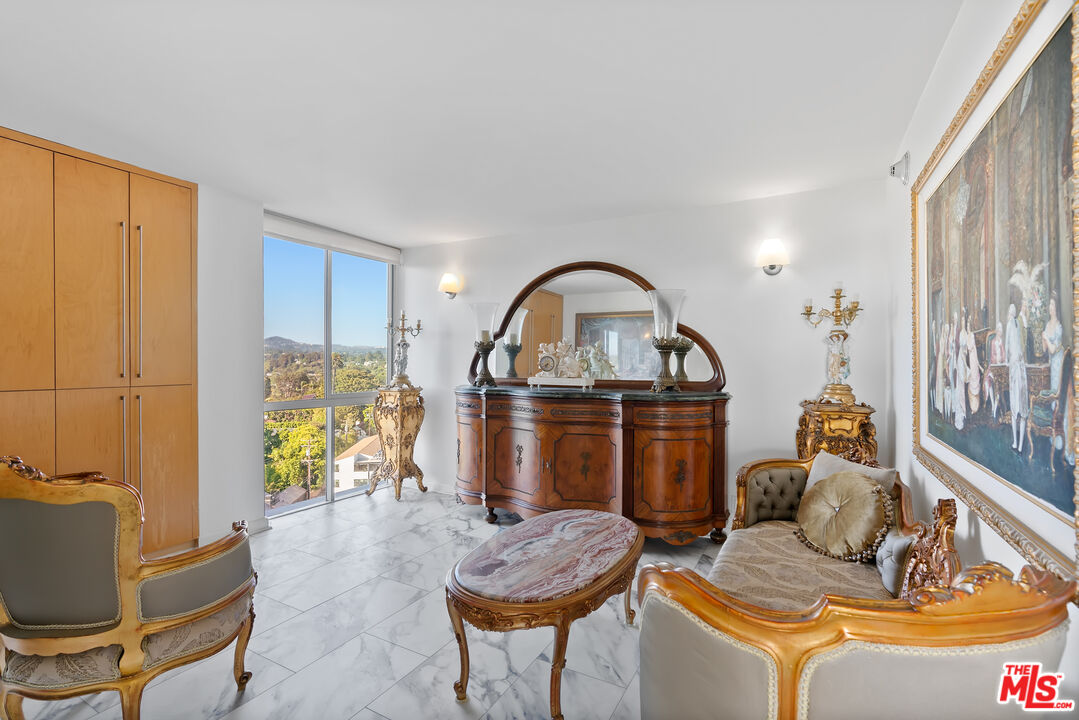 201 Ocean Avenue, Unit 1204B Santa Monica, CA 90402 - Photo 9 of 26 a living room with furniture a rug and a window