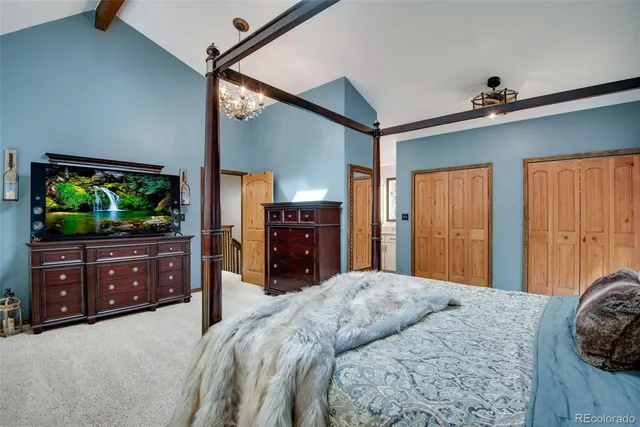 a bedroom with a bed and a dresser in it