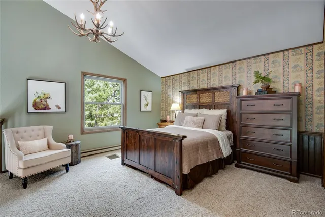 a bed room with a bed and a chair