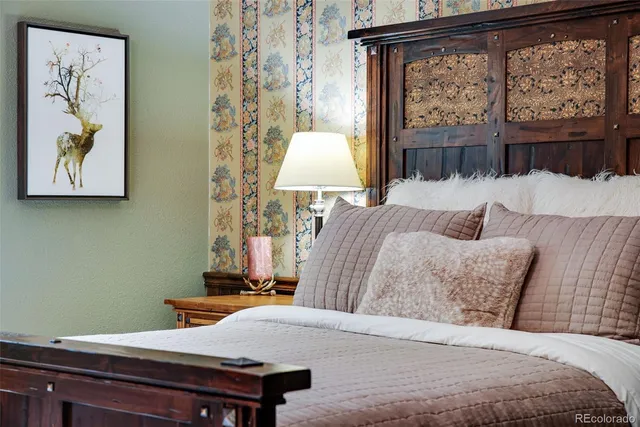 a bathroom with a sink a toilet a mirror and shower curtain